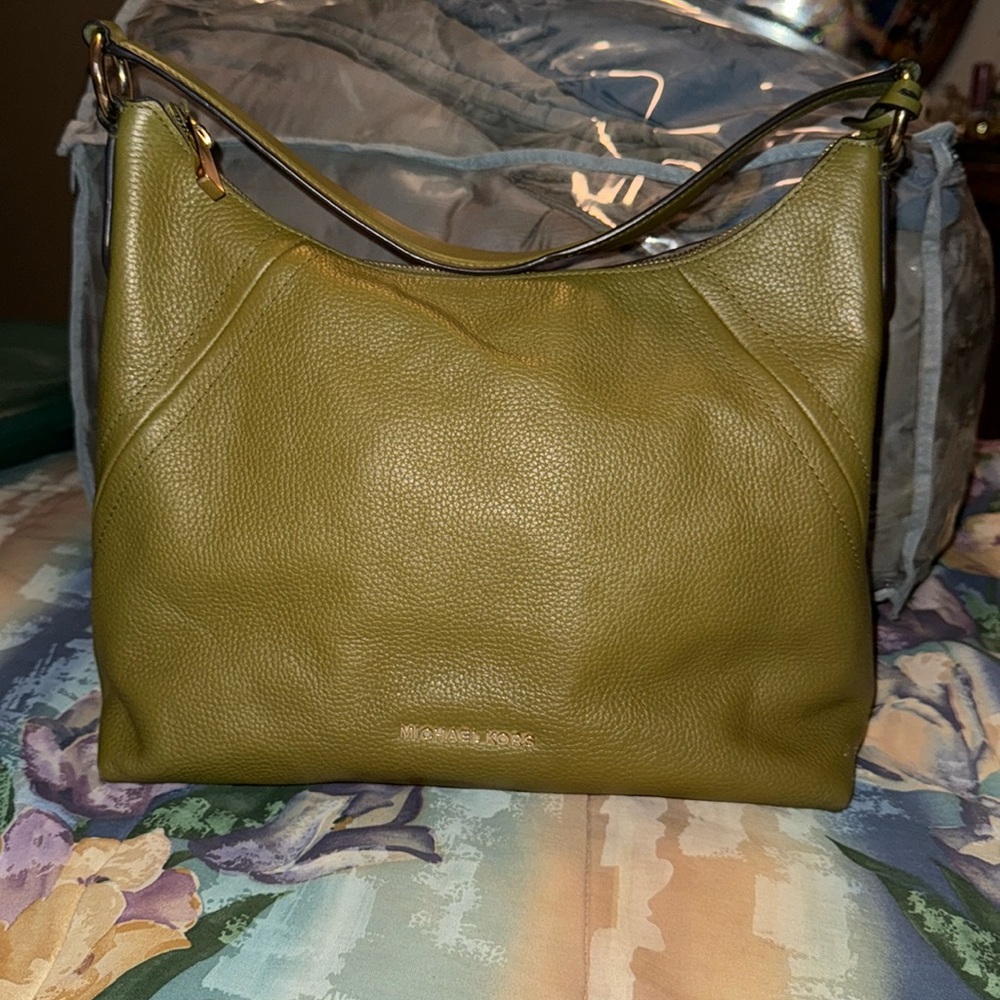 Michael Kors green purse with stains. Leather material